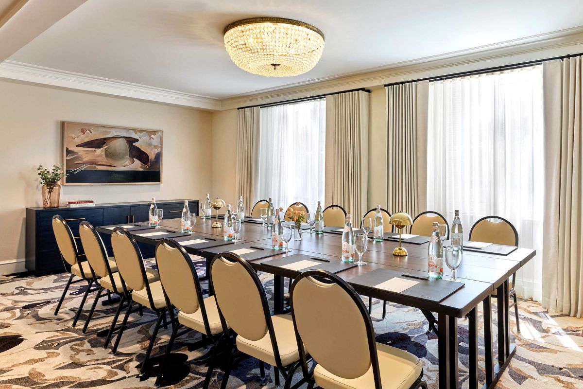 a conference room with a large table and chairs