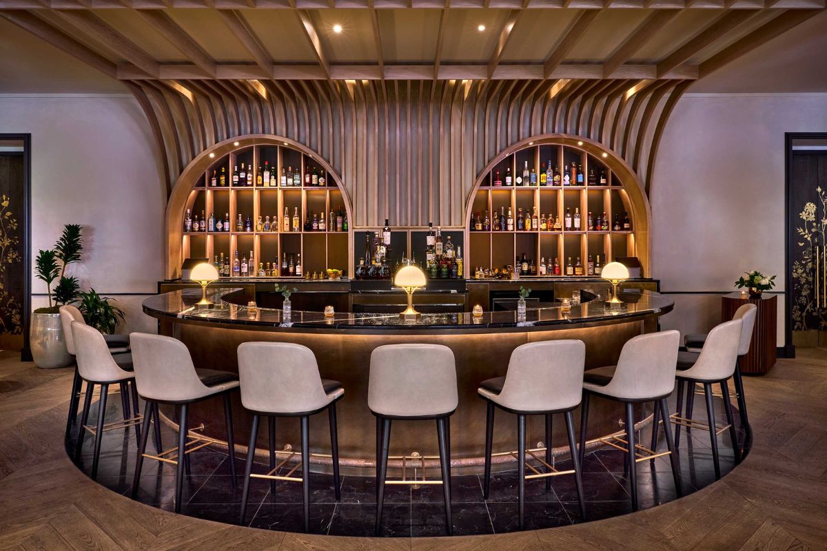 a bar with a bar and chairs