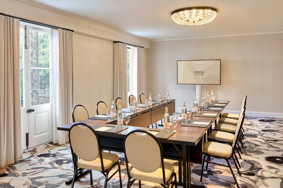 a conference room with a table and chairs