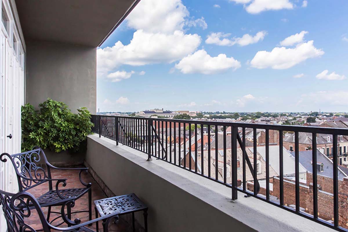a balcony with a view of a city