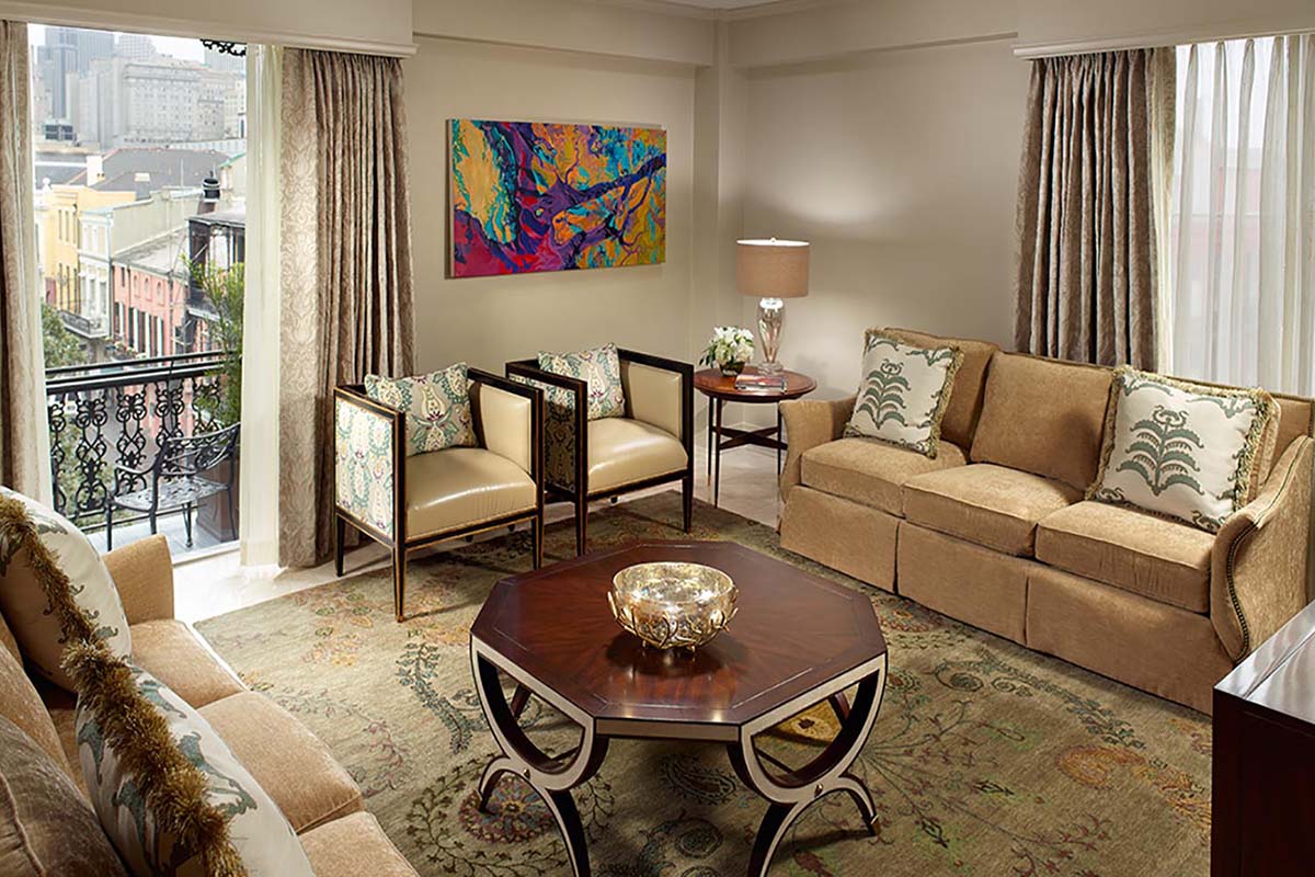 a living room with a couch and chairs