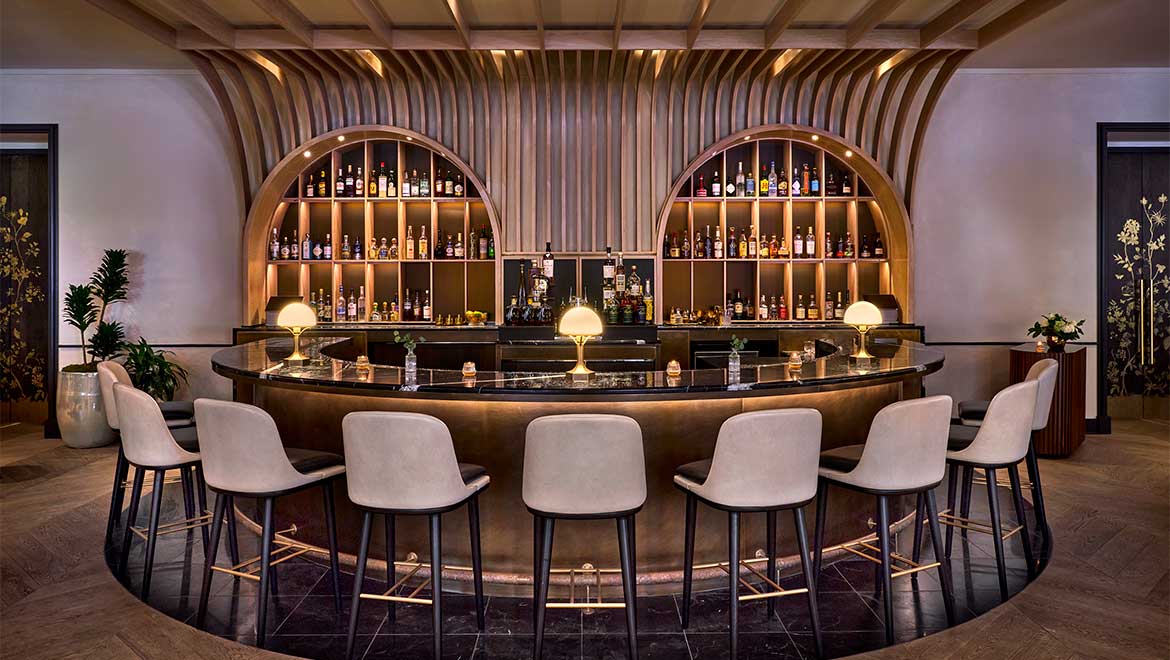 a bar with chairs and a table