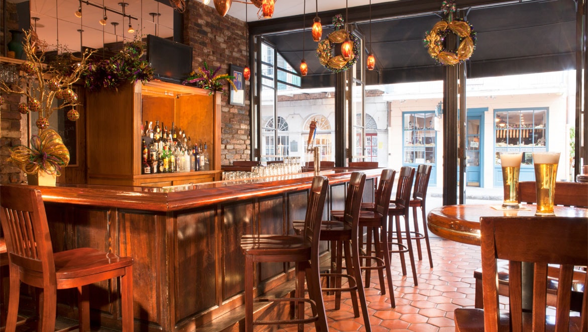 a bar with a counter and chairs