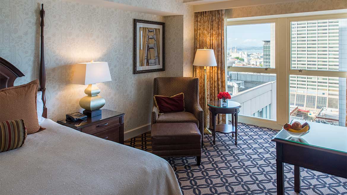 a bedroom with a bed and a chair
