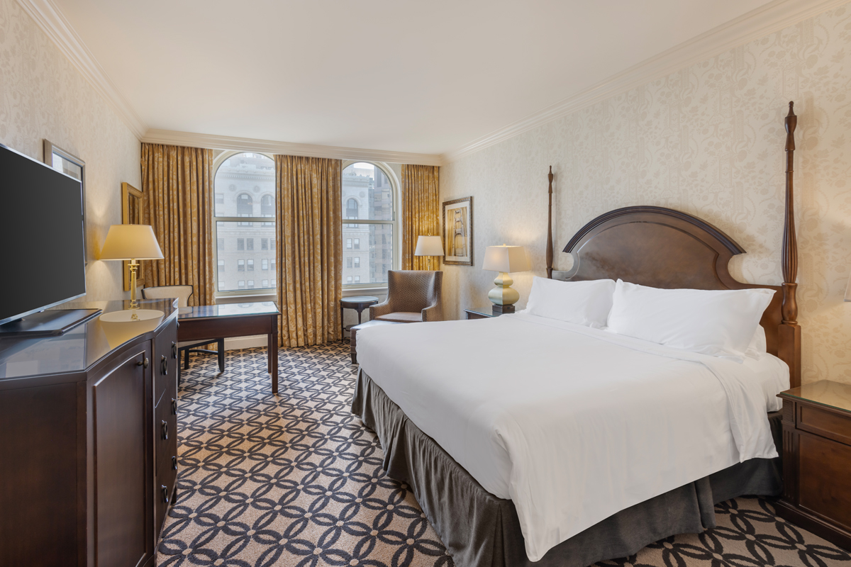 a room with a bed and a desk