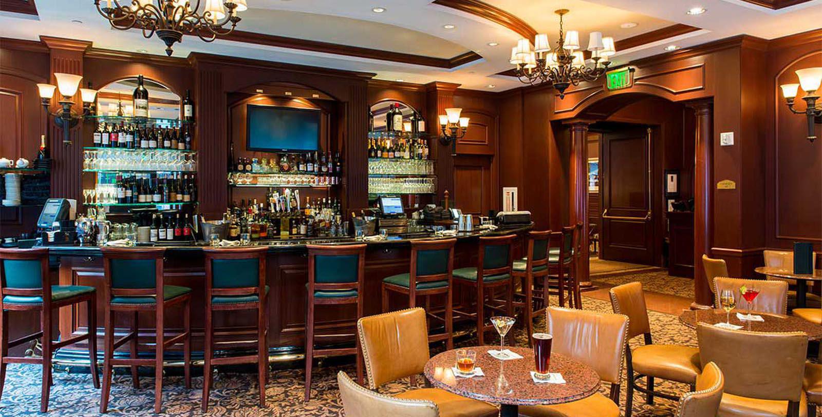 a bar with a counter and chairs