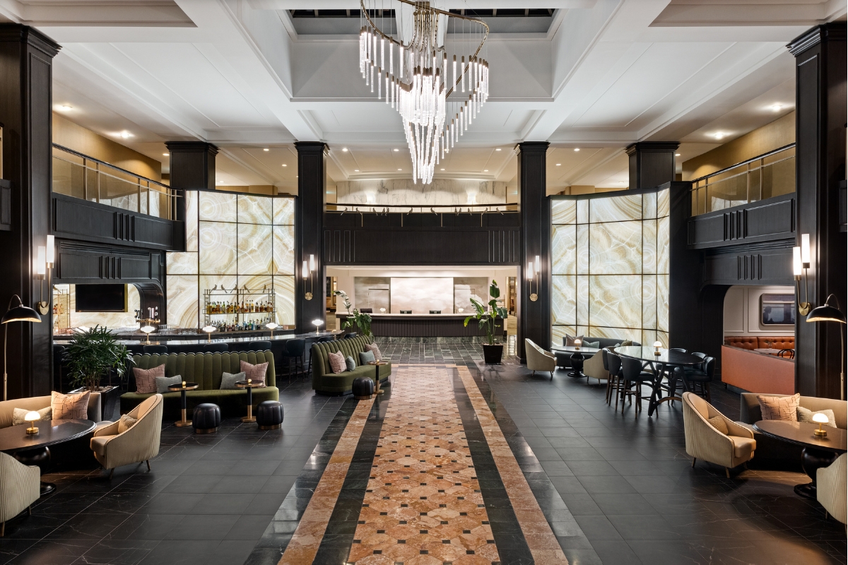 a large room with a chandelier and tables