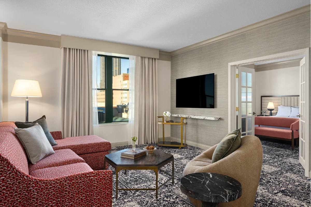 a living room with a television and couches