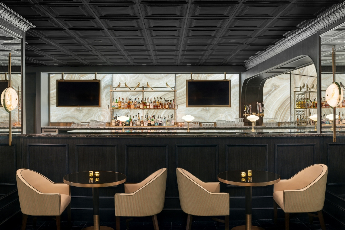 a bar with a counter and chairs