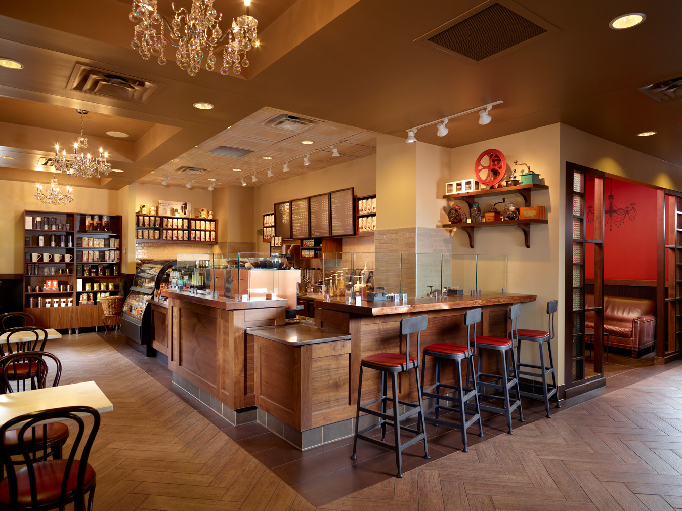a coffee shop with a bar and chairs