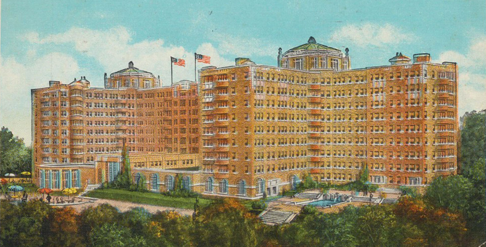 a large building with flags on top