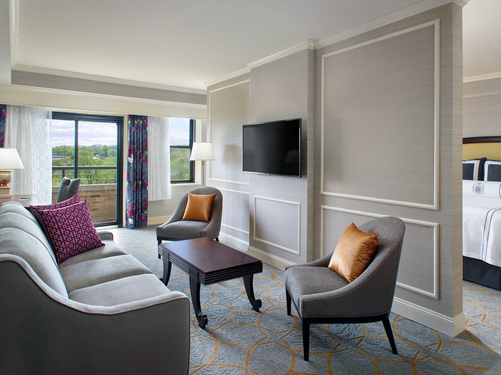 a living room with a television and couches