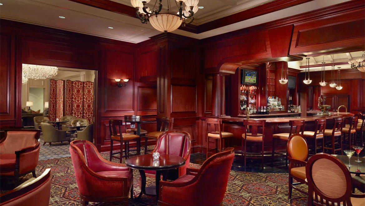a room with red chairs and tables