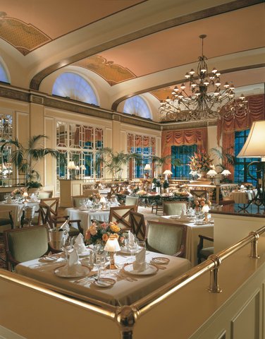 a restaurant with tables and chairs