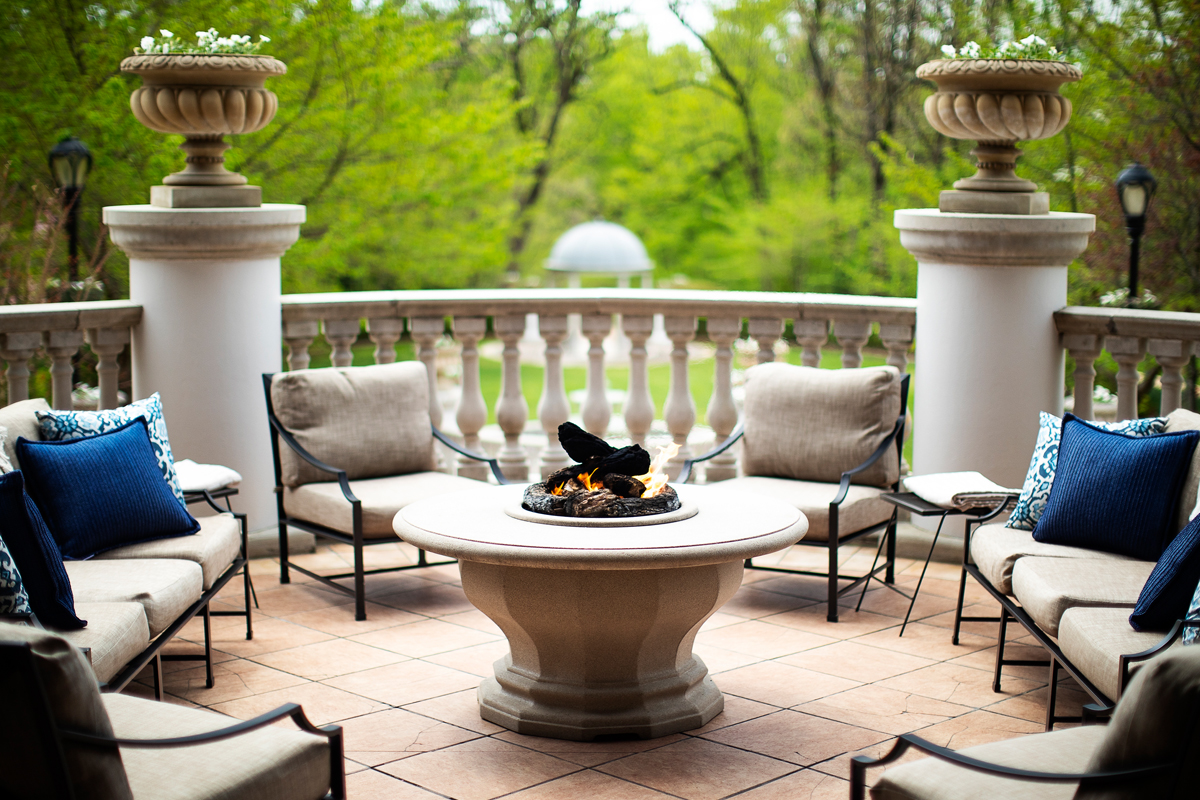 a fire pit with chairs around it