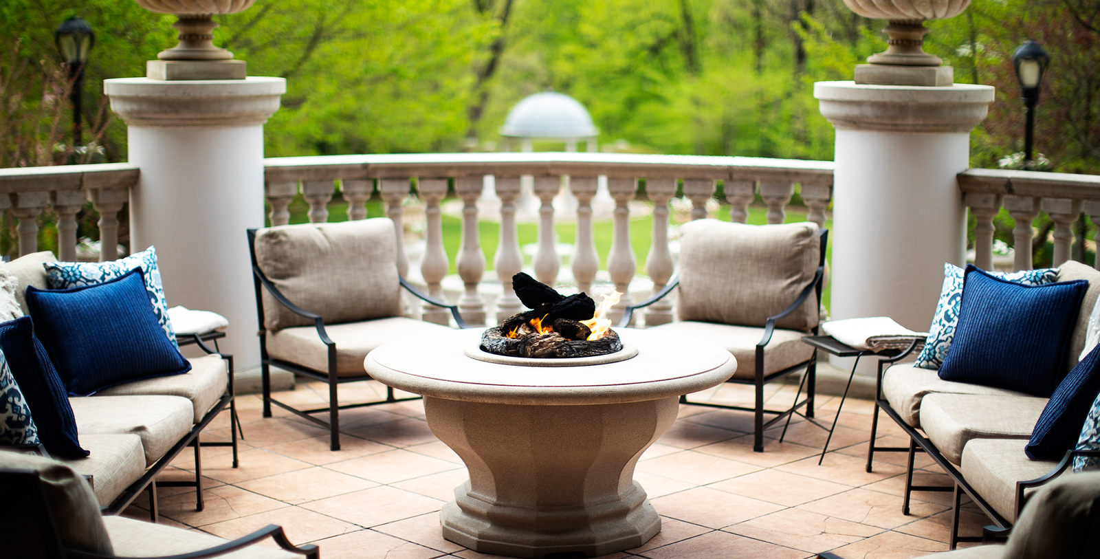 a fire pit with chairs around it