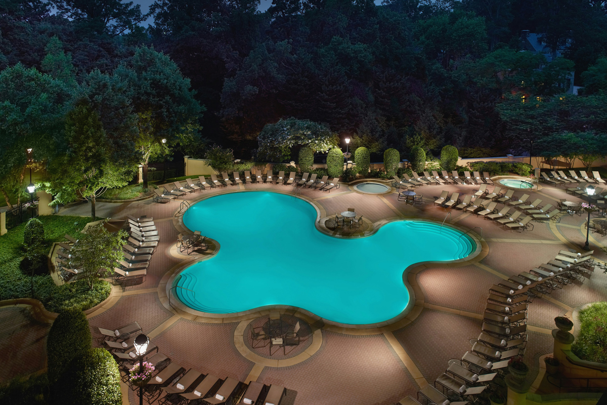 a pool with chairs around it
