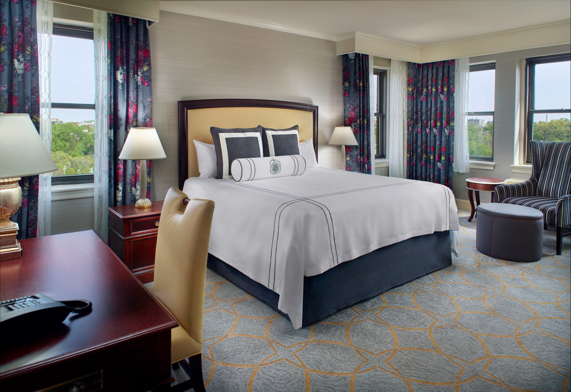 a bedroom with a bed and a desk