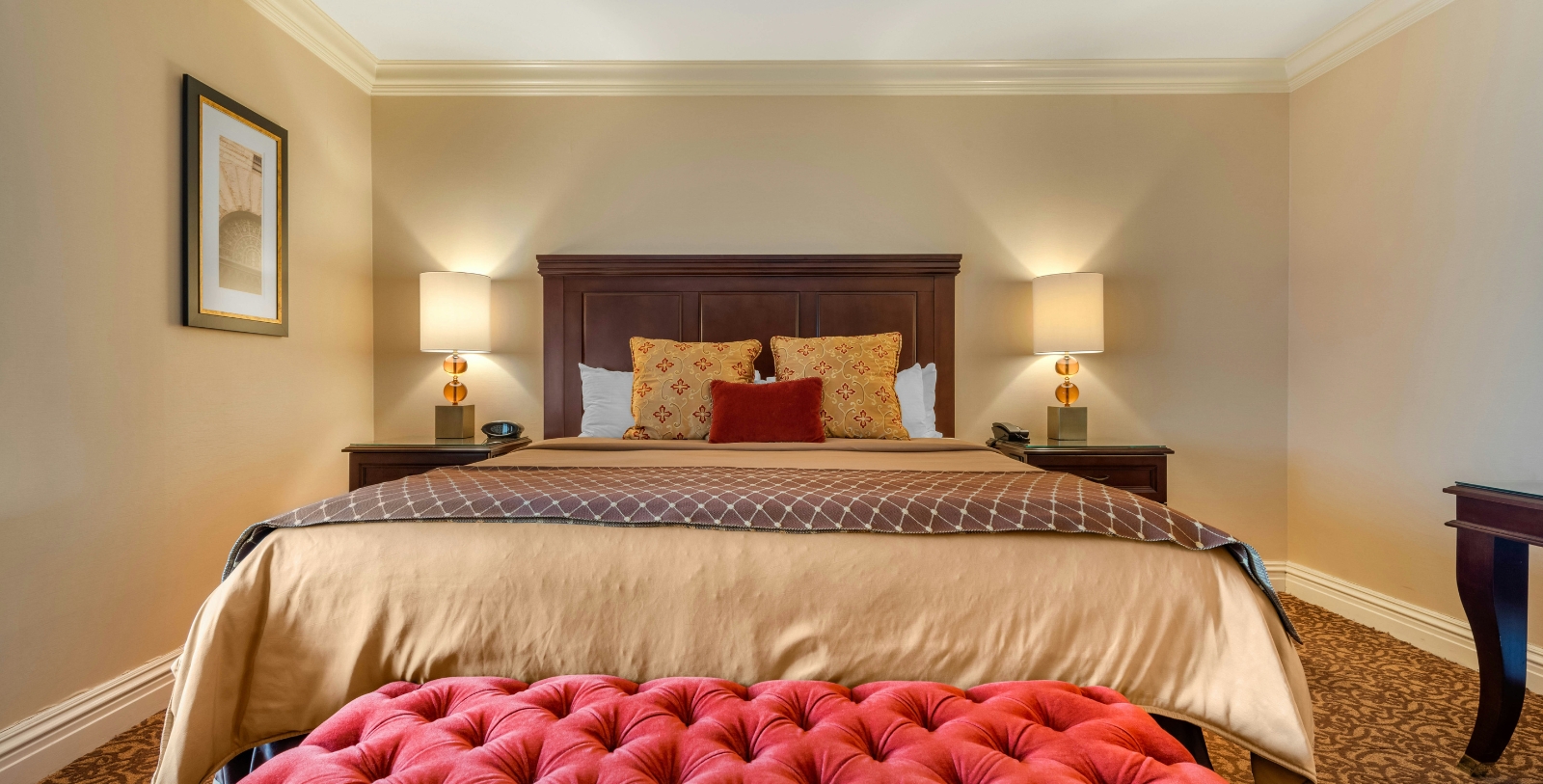 a bed with a red cushion