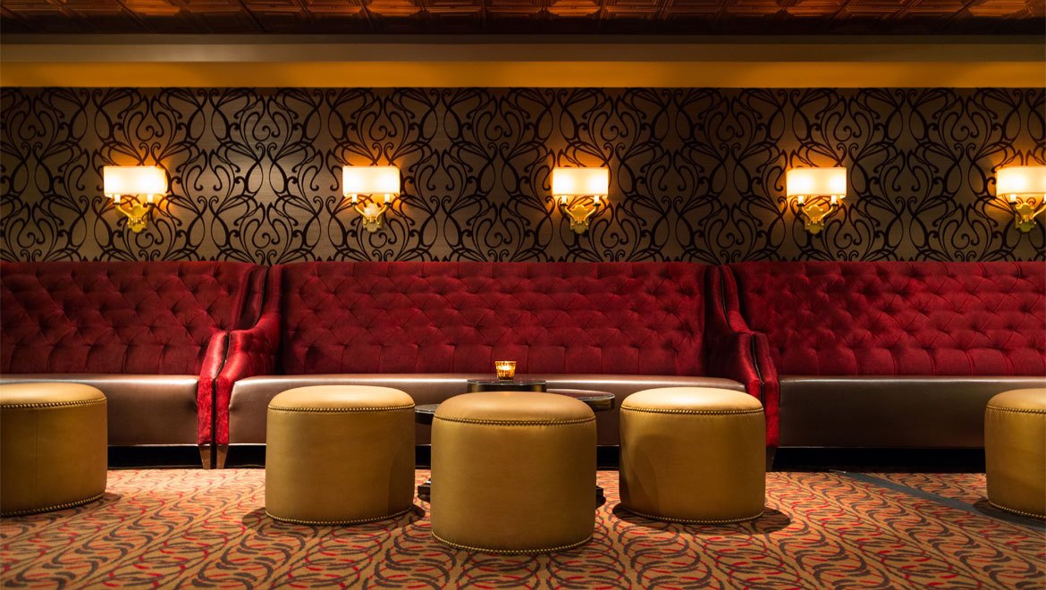 a room with a couch and stools