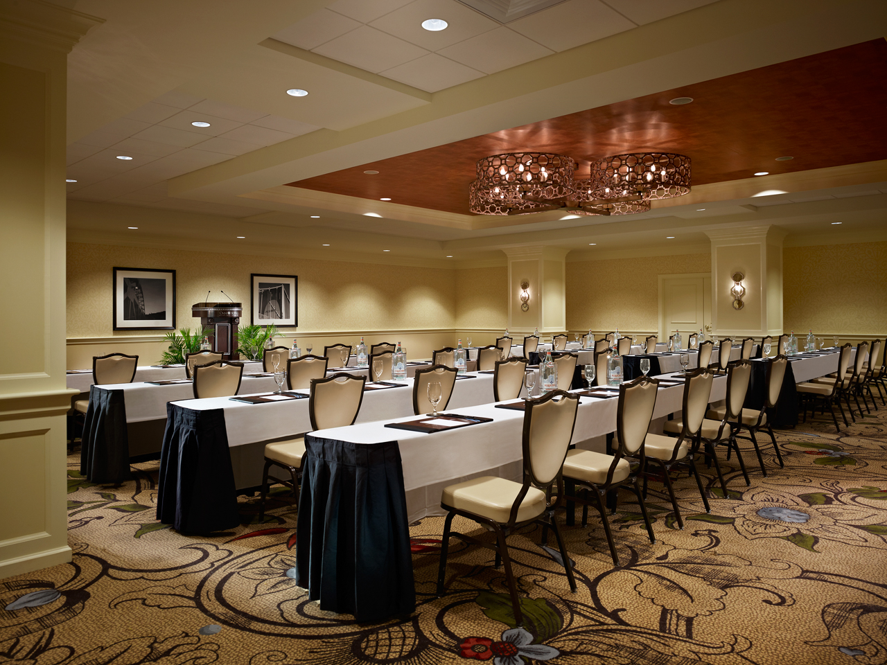 a room with long tables and chairs