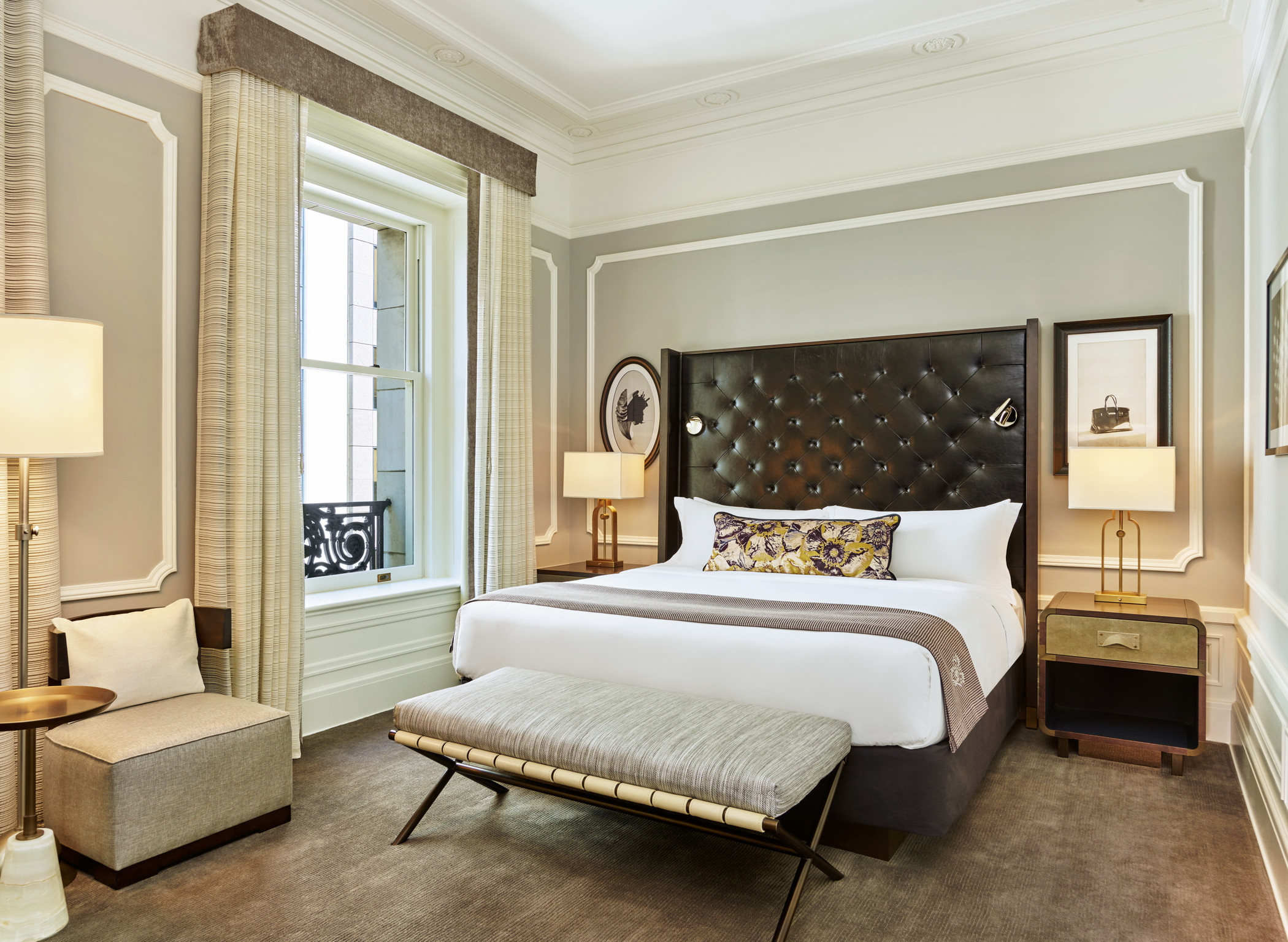a bedroom with a bed and a bench