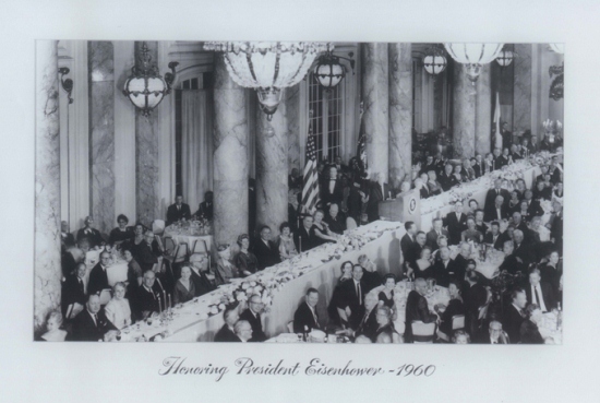 a group of people sitting at a table