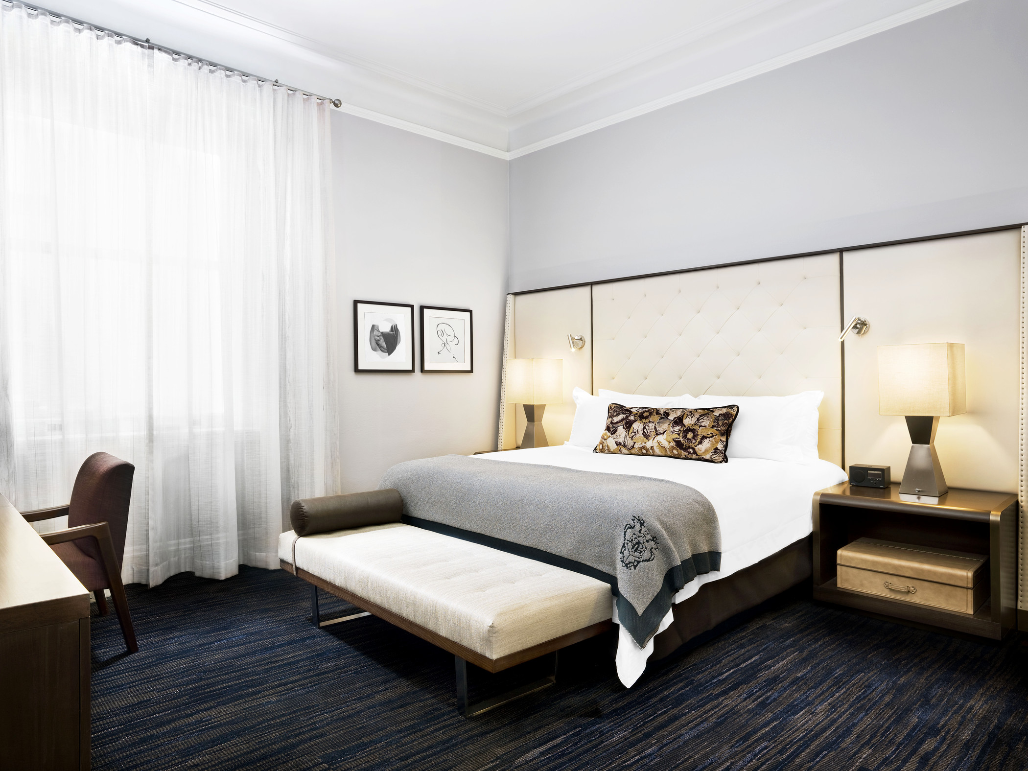 a bed with a bench in a room