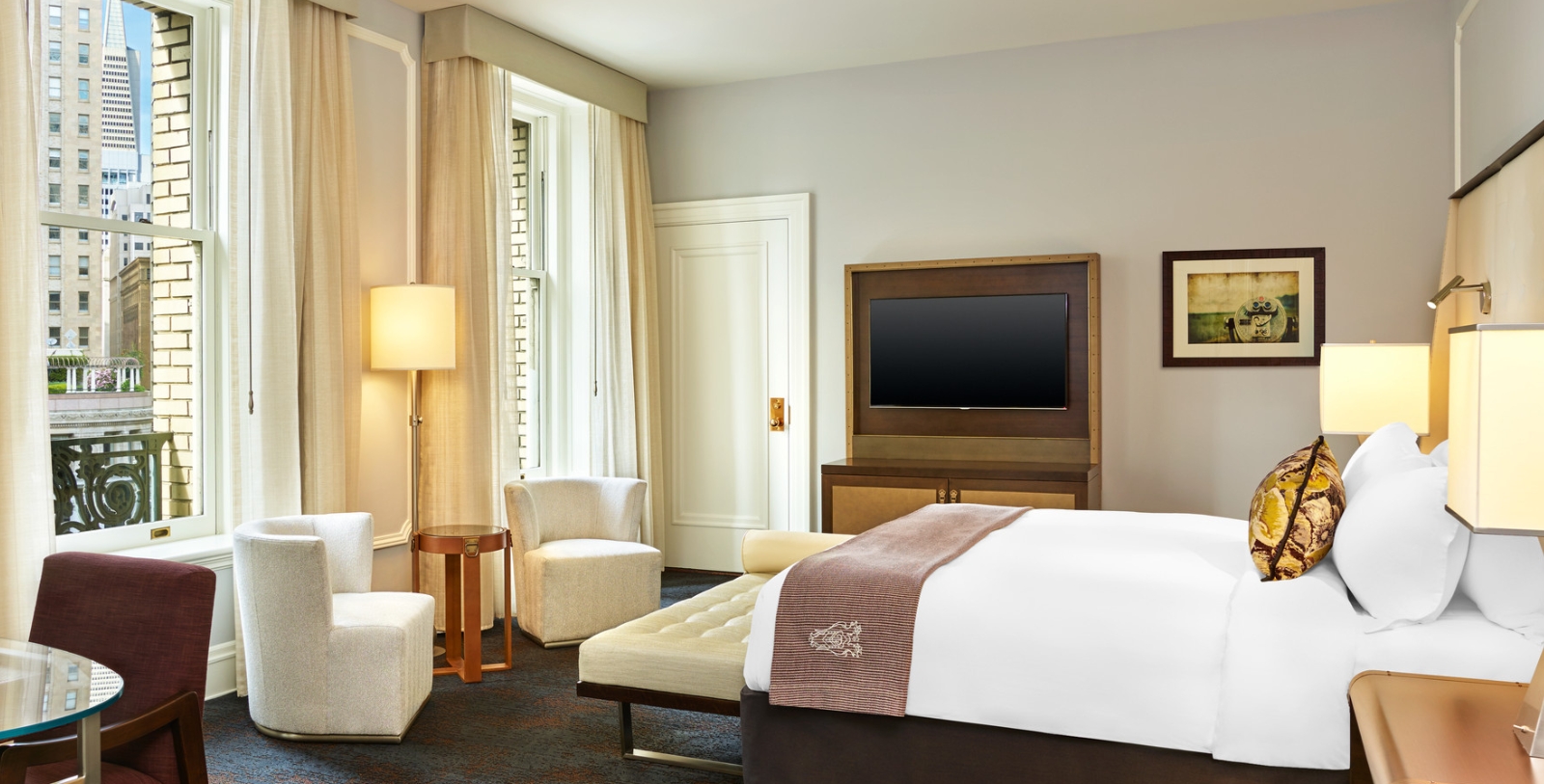 a room with a bed and a television