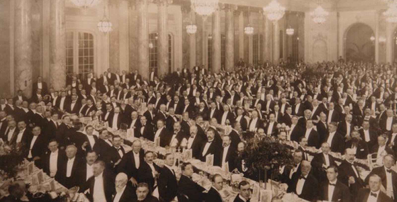 a large group of people sitting at tables