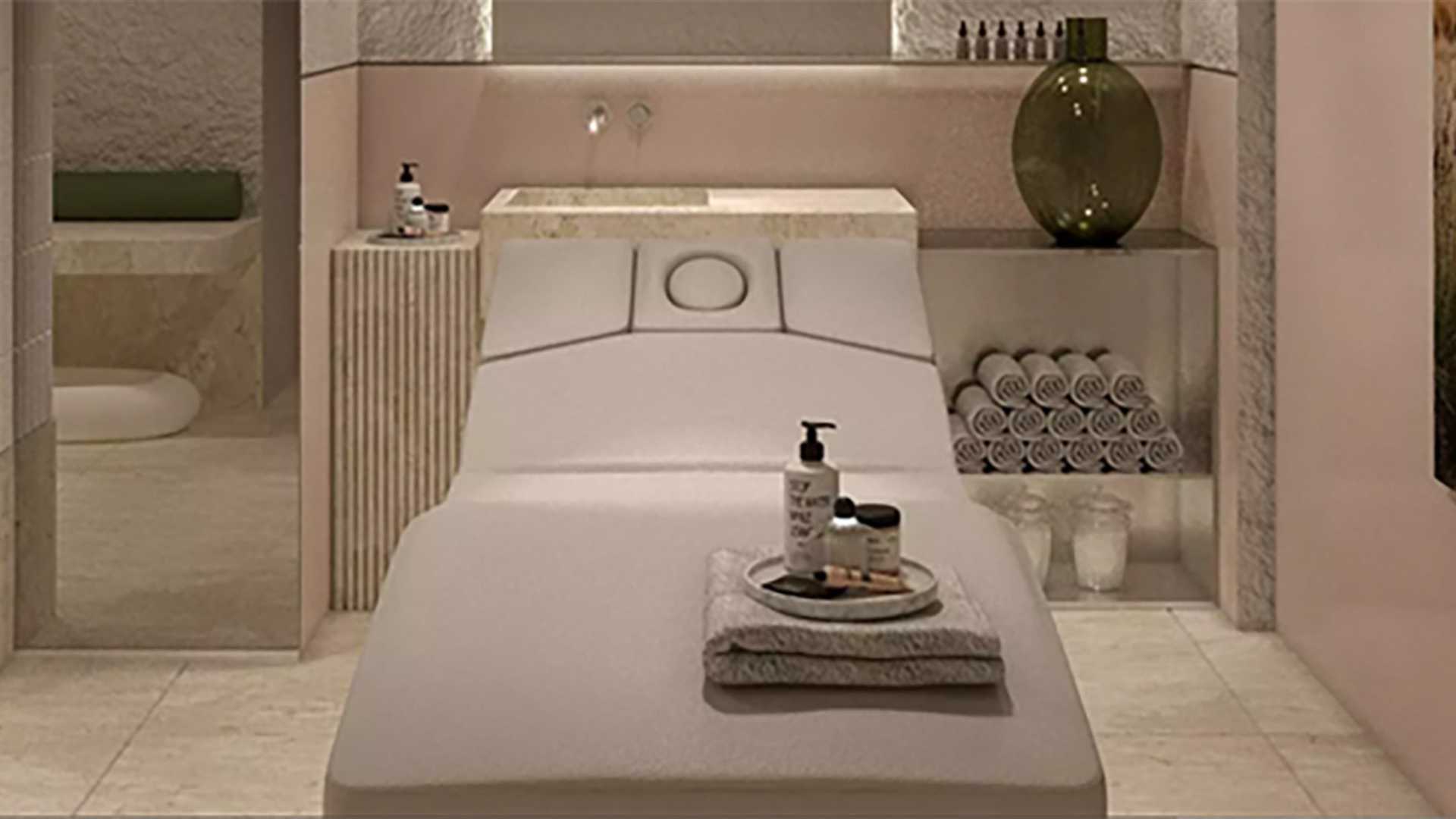 a massage table with a tray of products on it