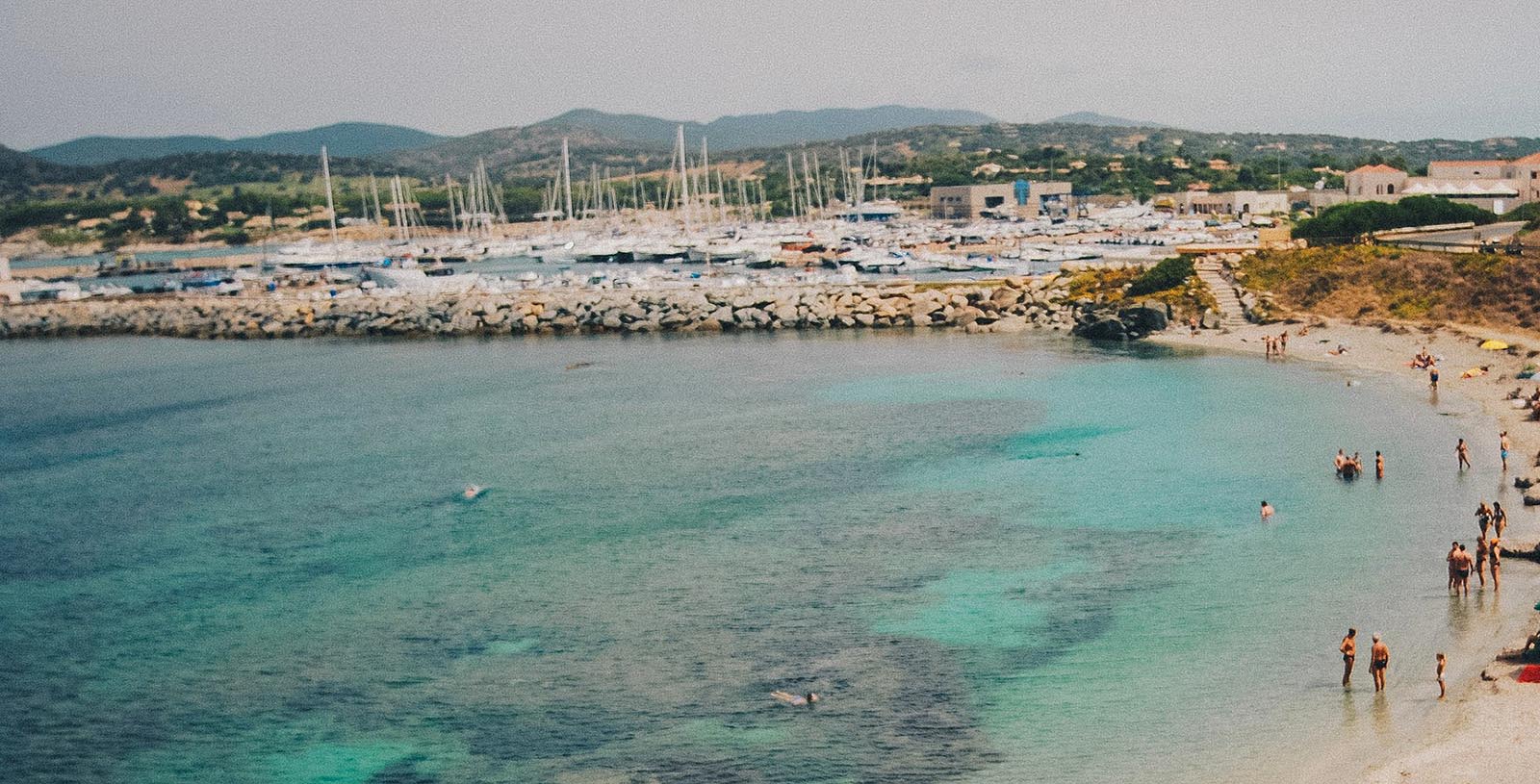 a body of water with boats in the background