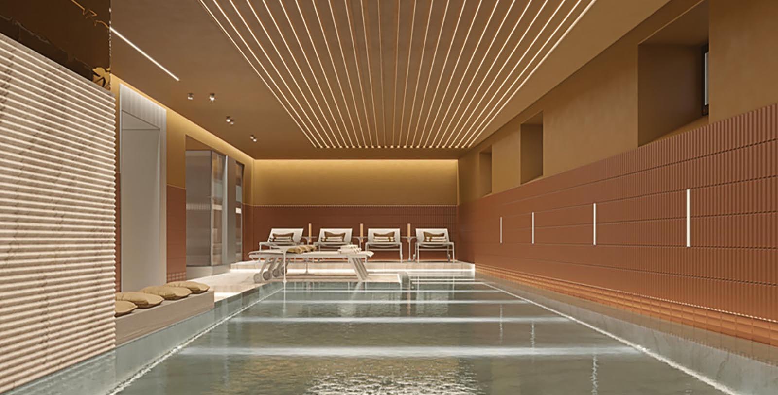 a indoor pool with a row of chairs and a glass door