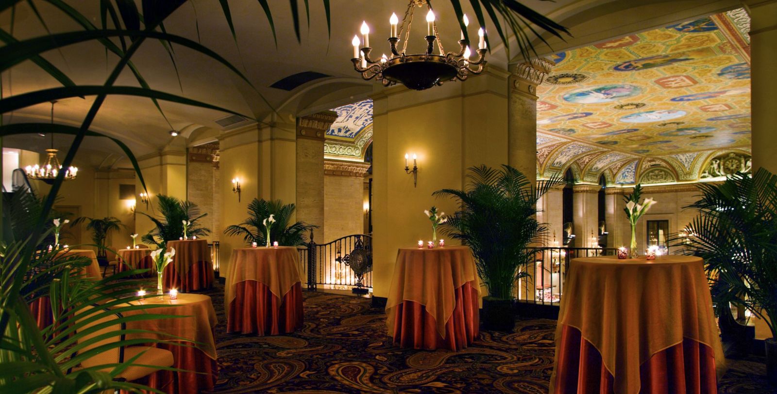 a room with tables and plants