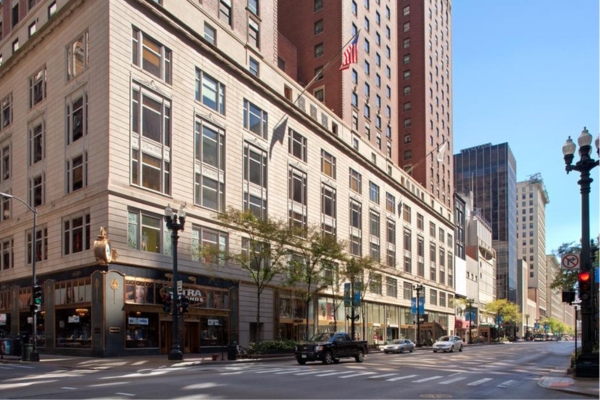 a city street with cars and buildings