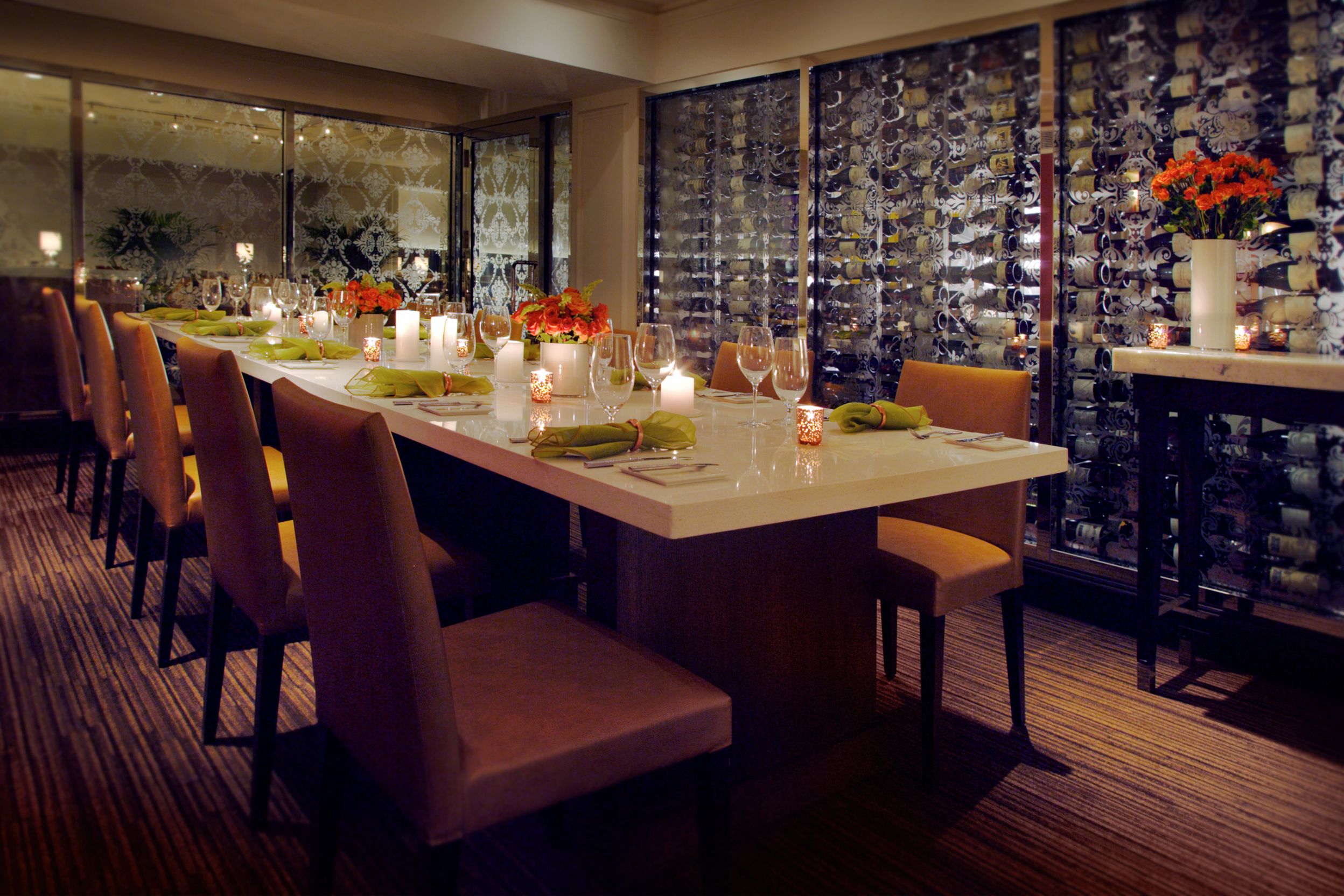 a table with wine glasses and candles