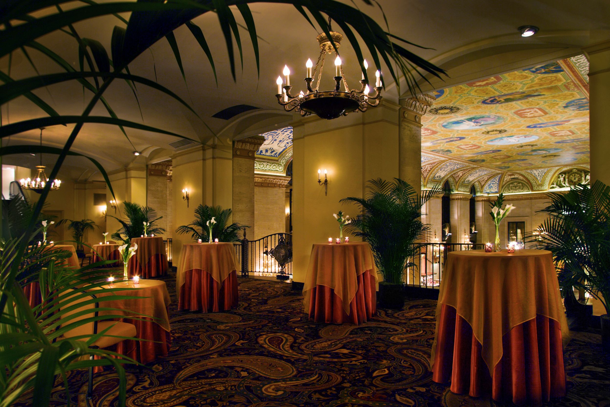 a room with tables and plants