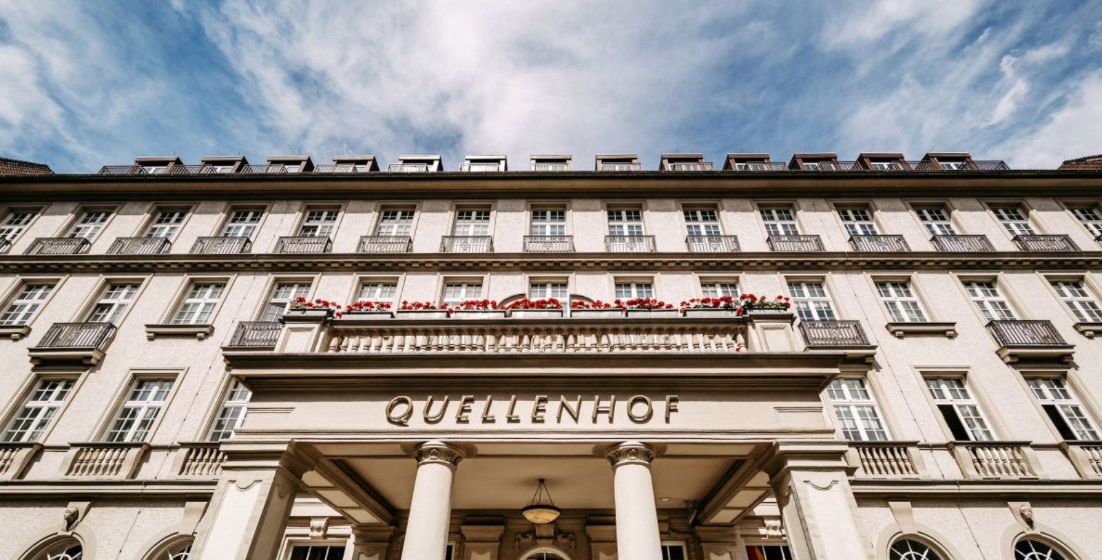 a building with columns and a sign