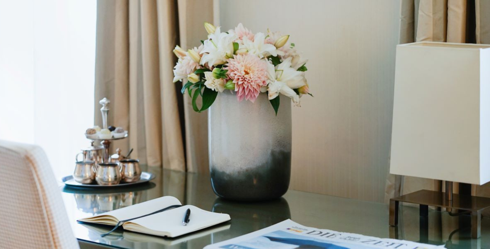 a vase with flowers on a table