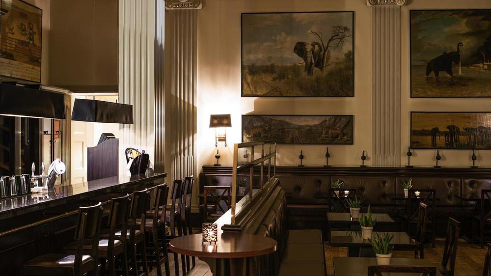 a room with a table and chairs
