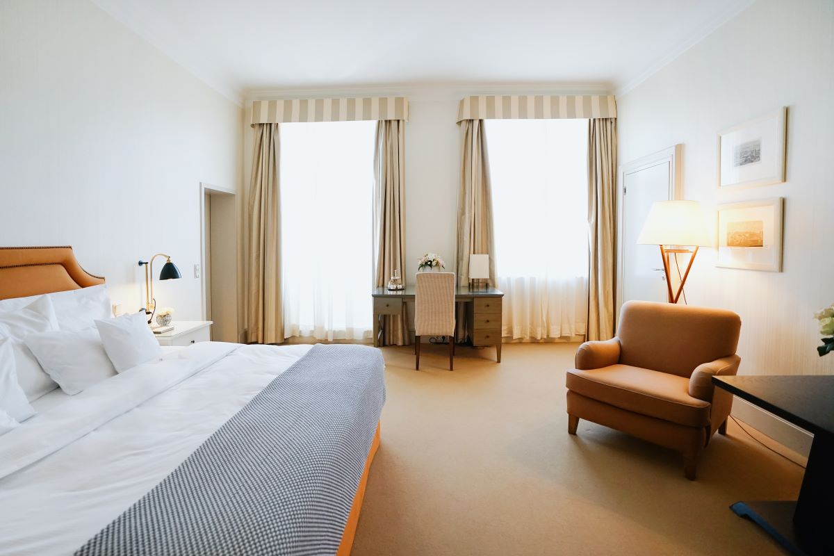 a bedroom with a bed and a chair