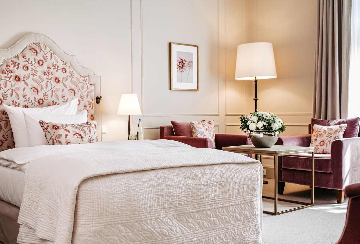 a bedroom with a bed and a couch