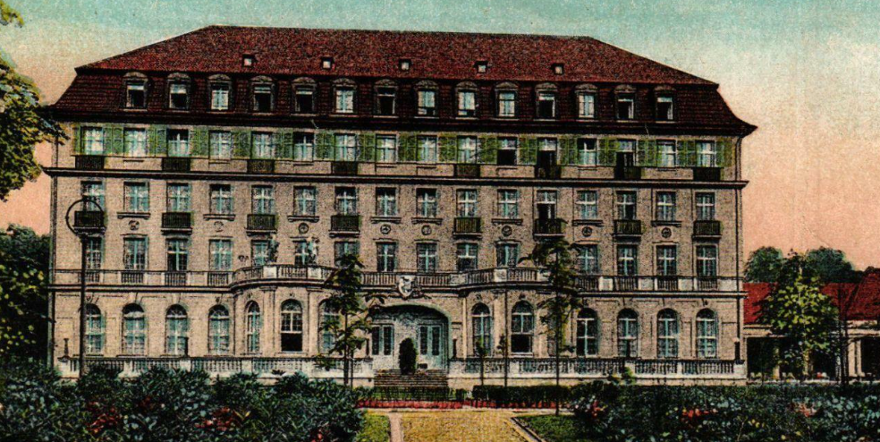 a large building with a lawn and a lawn