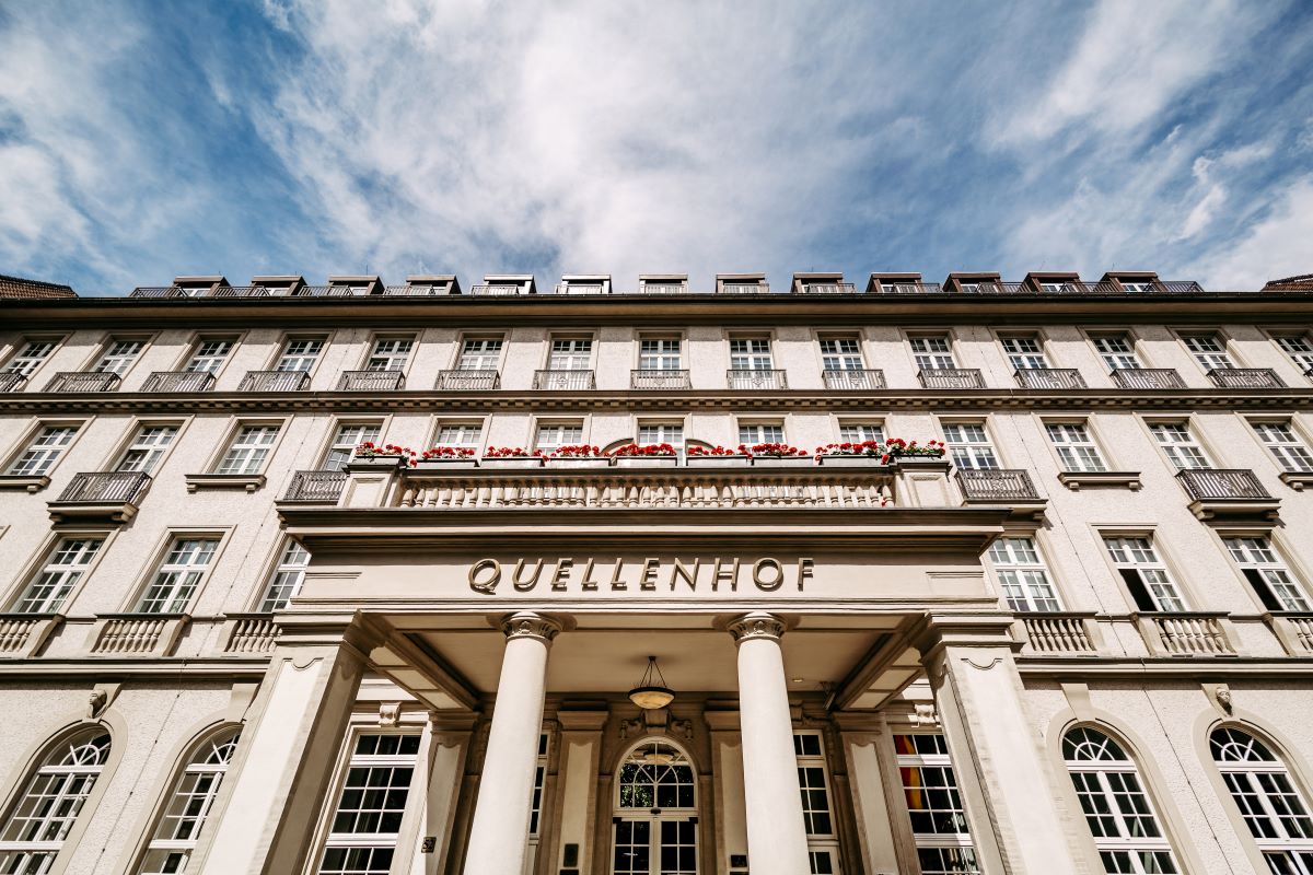 a building with columns and a sign