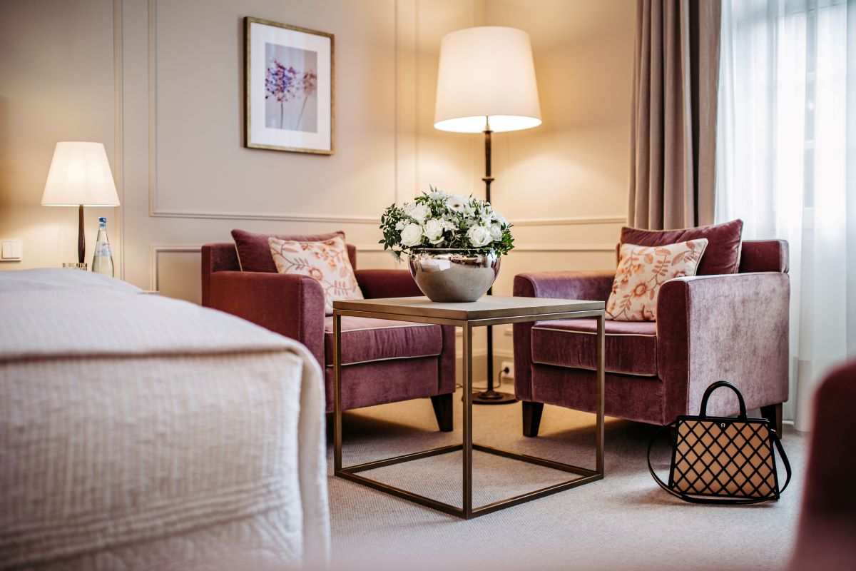 a room with purple chairs and a lamp