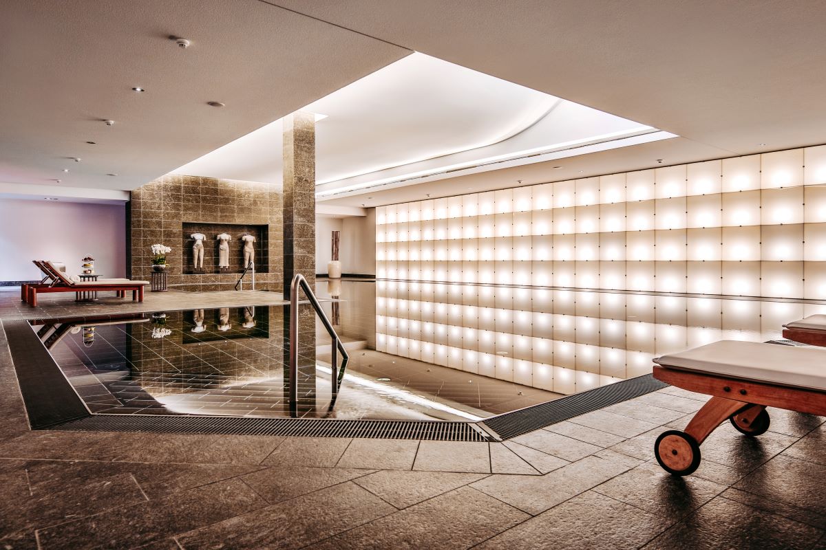 a swimming pool with a bench and a bench