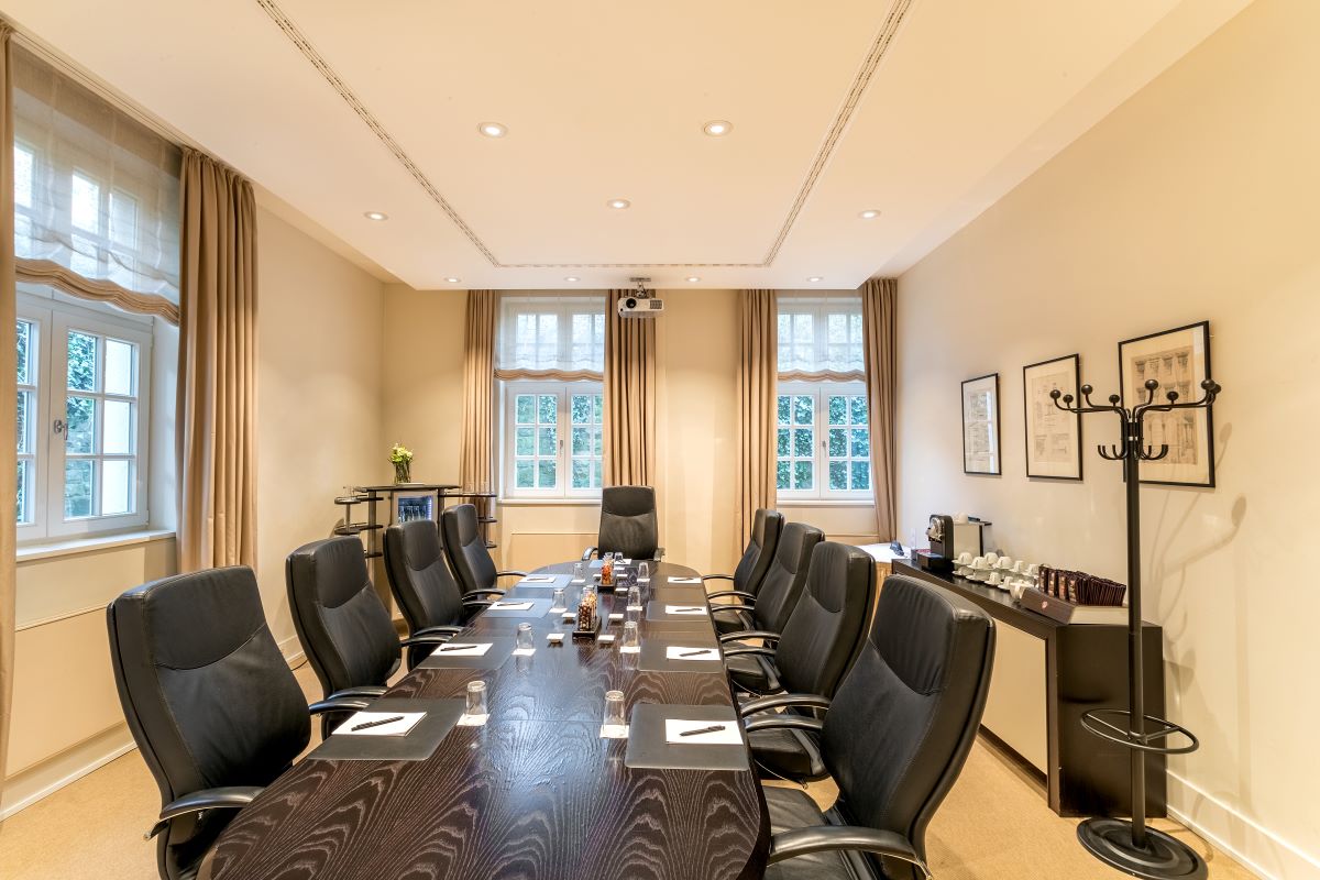 a conference room with a table and chairs