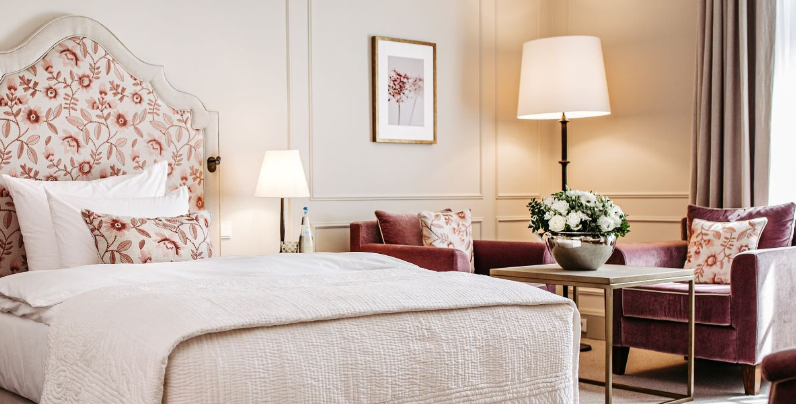 a bedroom with a bed and a lamp