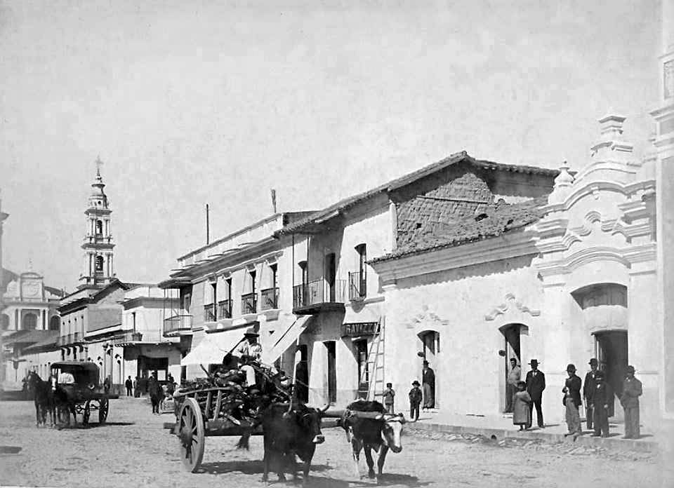 a group of people walking in front of a building