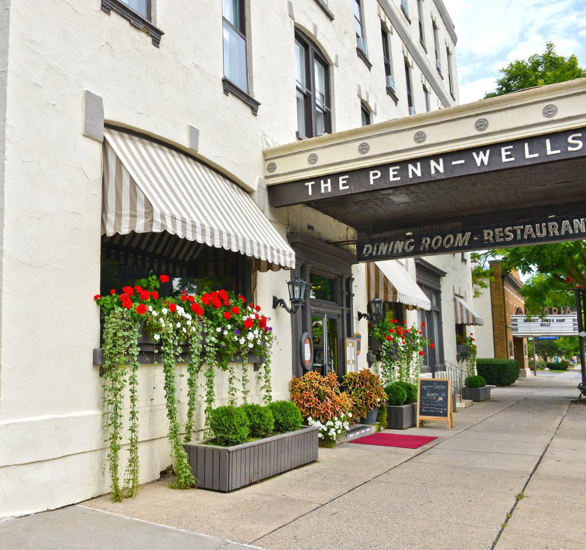 a building with flowers on the front